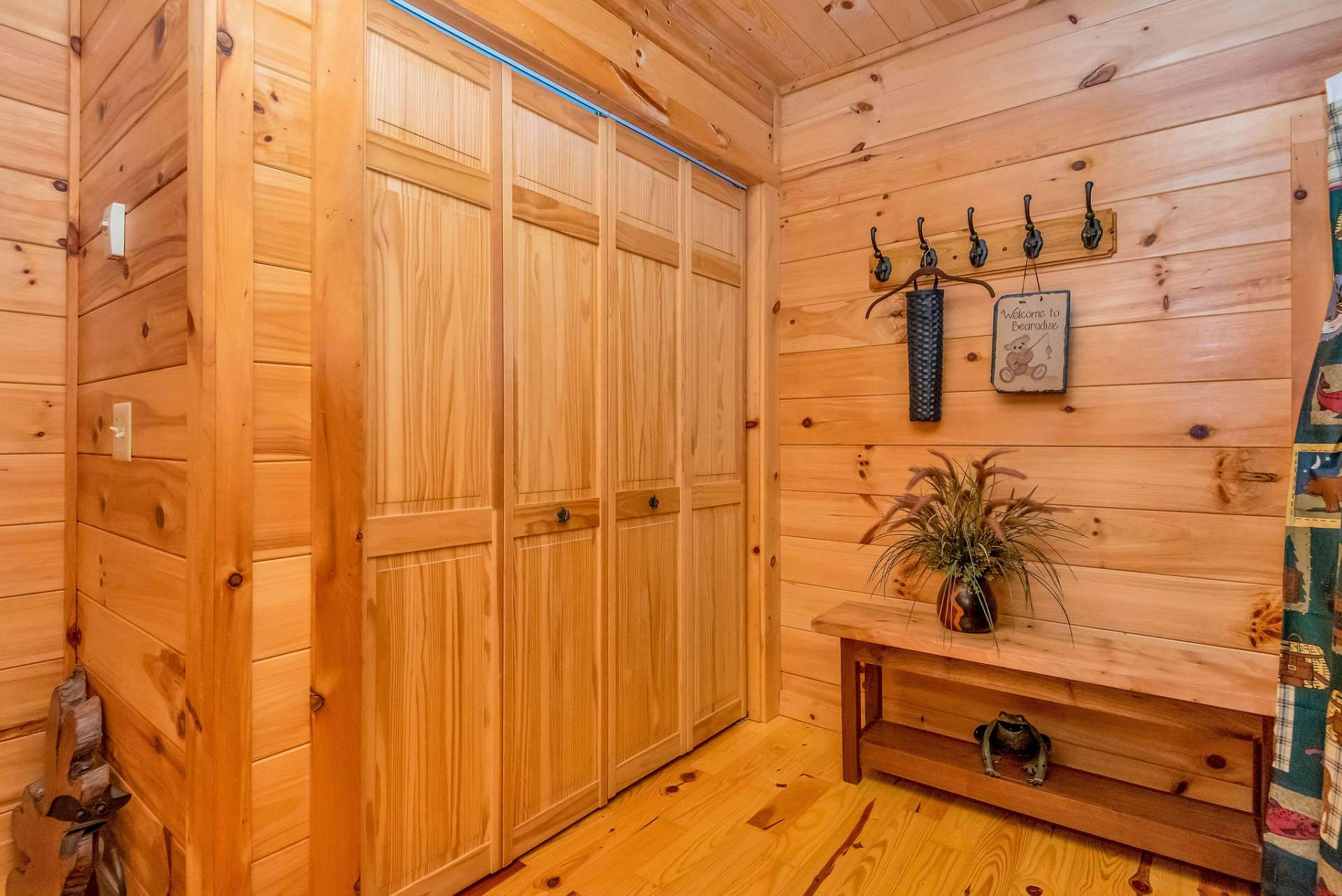 The washer and dryer are conveniently concealed within the main level bathroom.